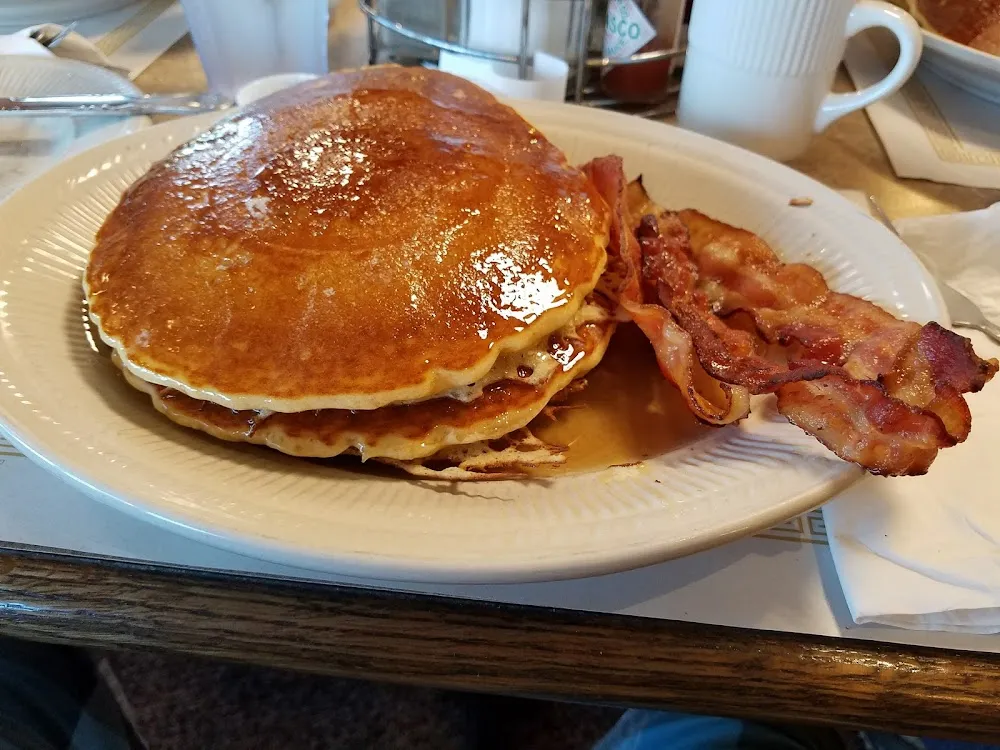 Two Pancakes One Egg with 2 PC Bacon or Sausage